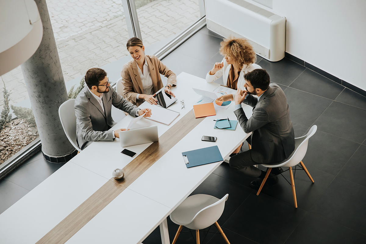 team of coworkers at large desk